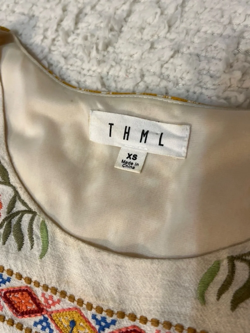 Embroidered Summer Dress by THML. Bib Sundress with Tassel Trim